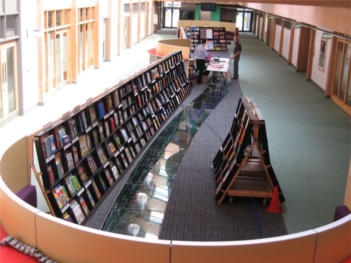 Look, there's the same number of books beyond the cash desk!